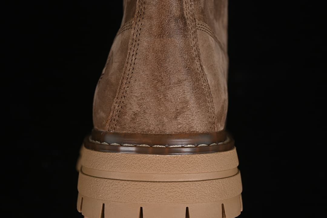 Rear view highlighting the boot heel and layered sole