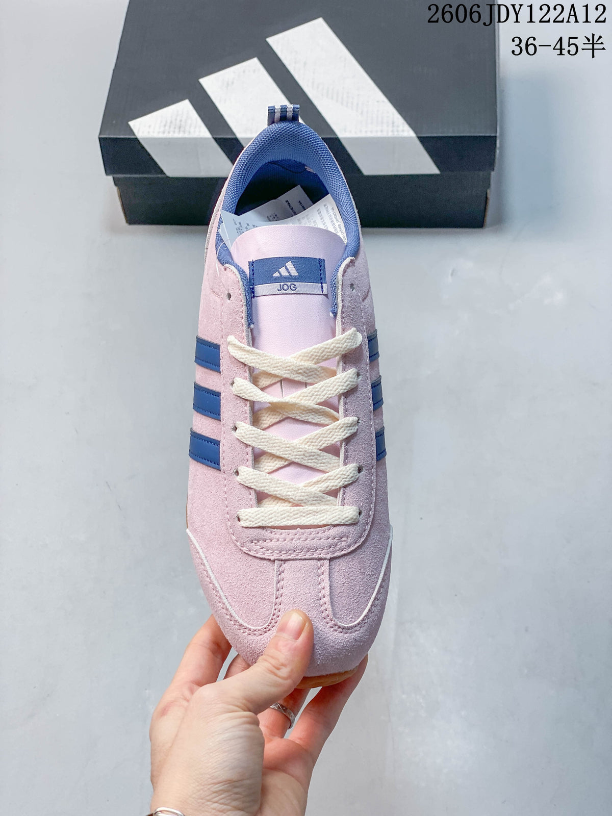 Top view of the sneaker showing cream laces, blue collar lining, and tongue label