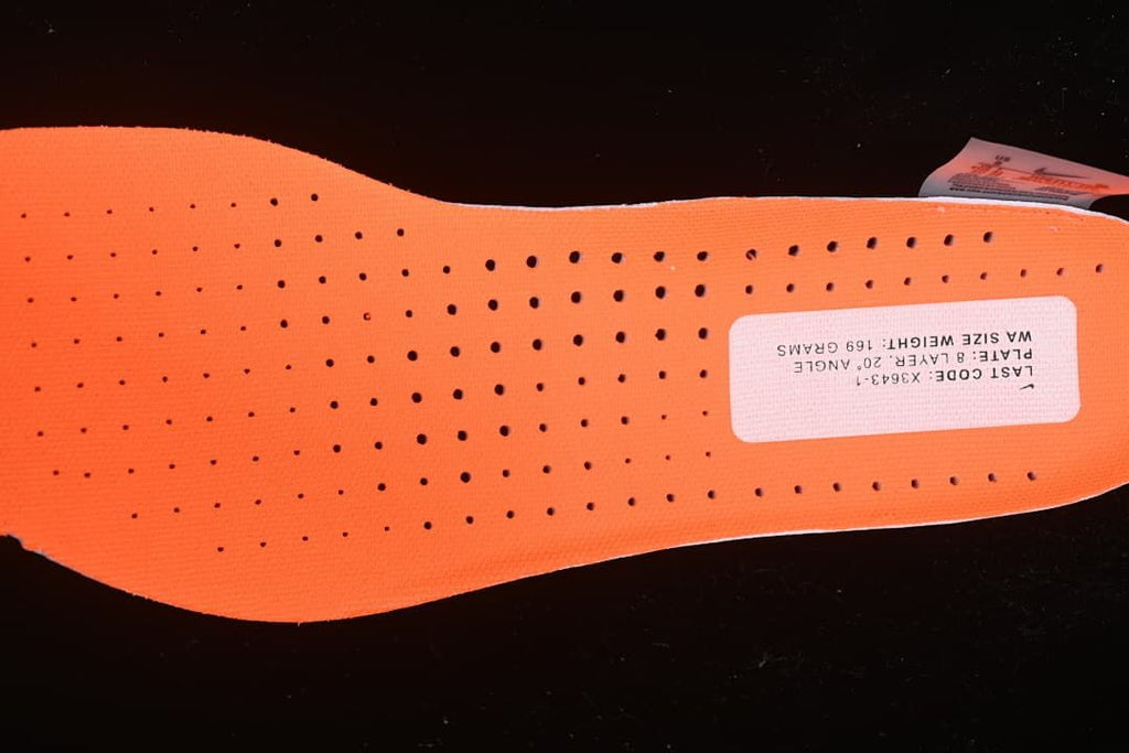 Close-up of the orange perforated insole and printed label