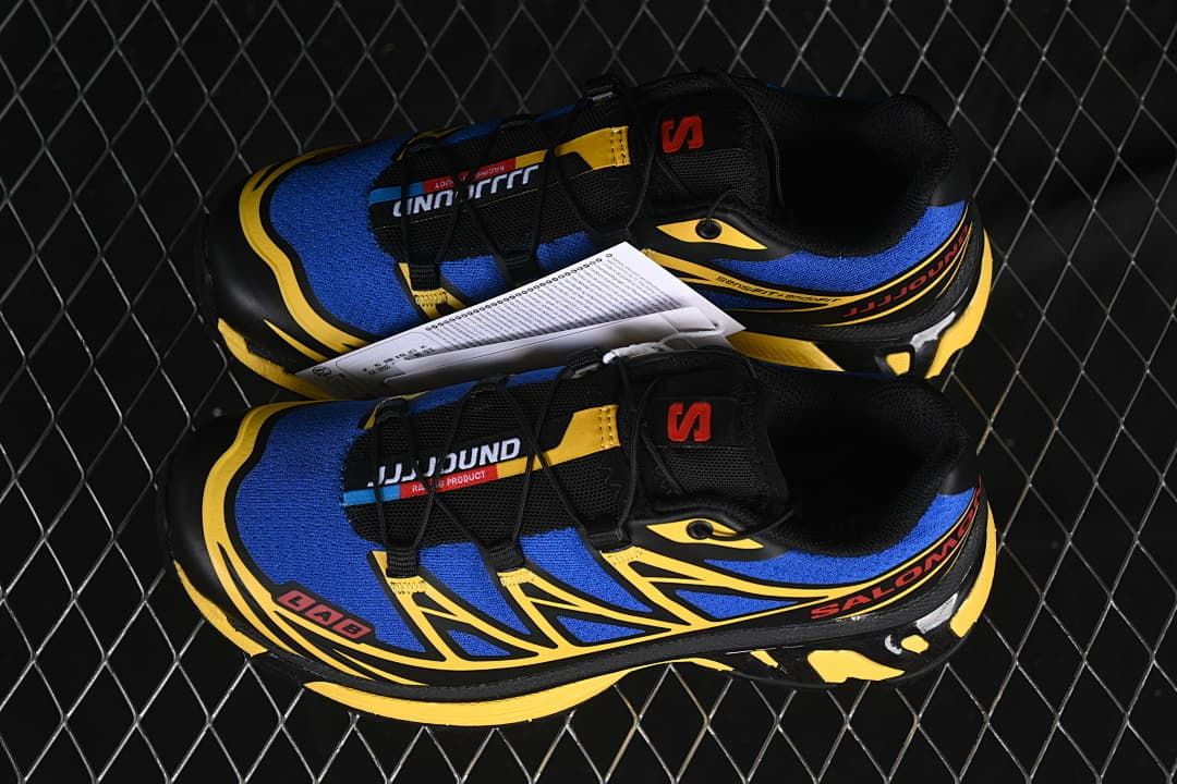 Pair of blue, yellow, and black sneakers shown from above