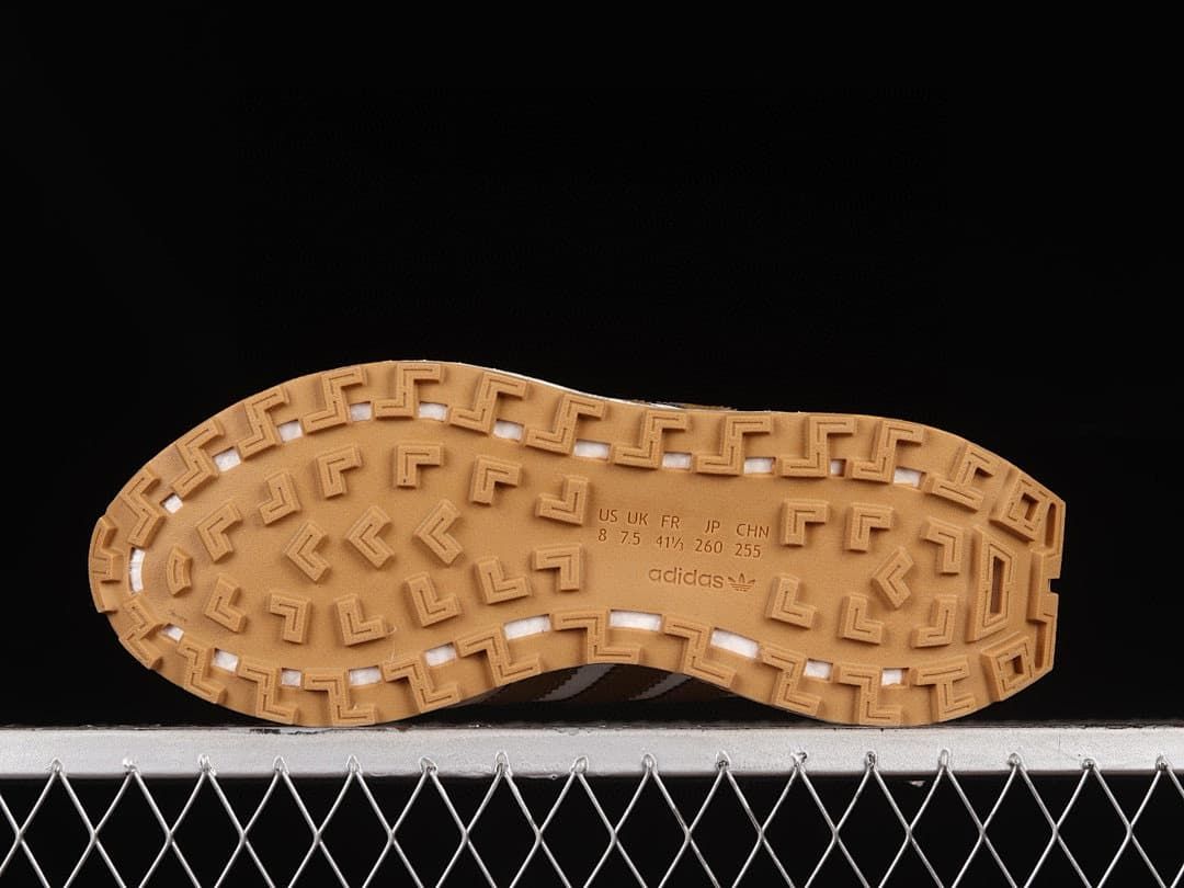 Gum-colored sneaker outsole with a size marking visible in the sample
