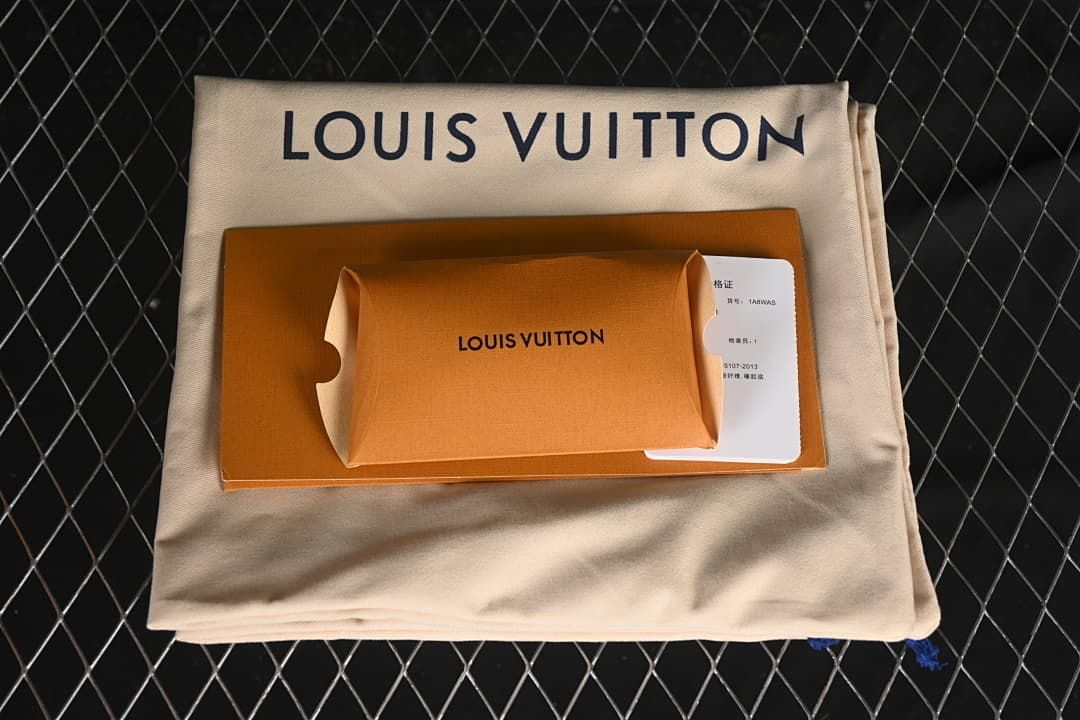 Sneaker packaging with branded dust bag, box, and card