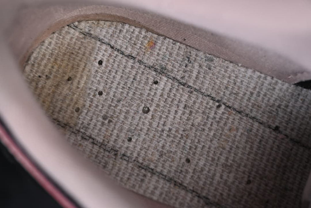 Interior close-up showing the shoe's footbed and pale pink lining.