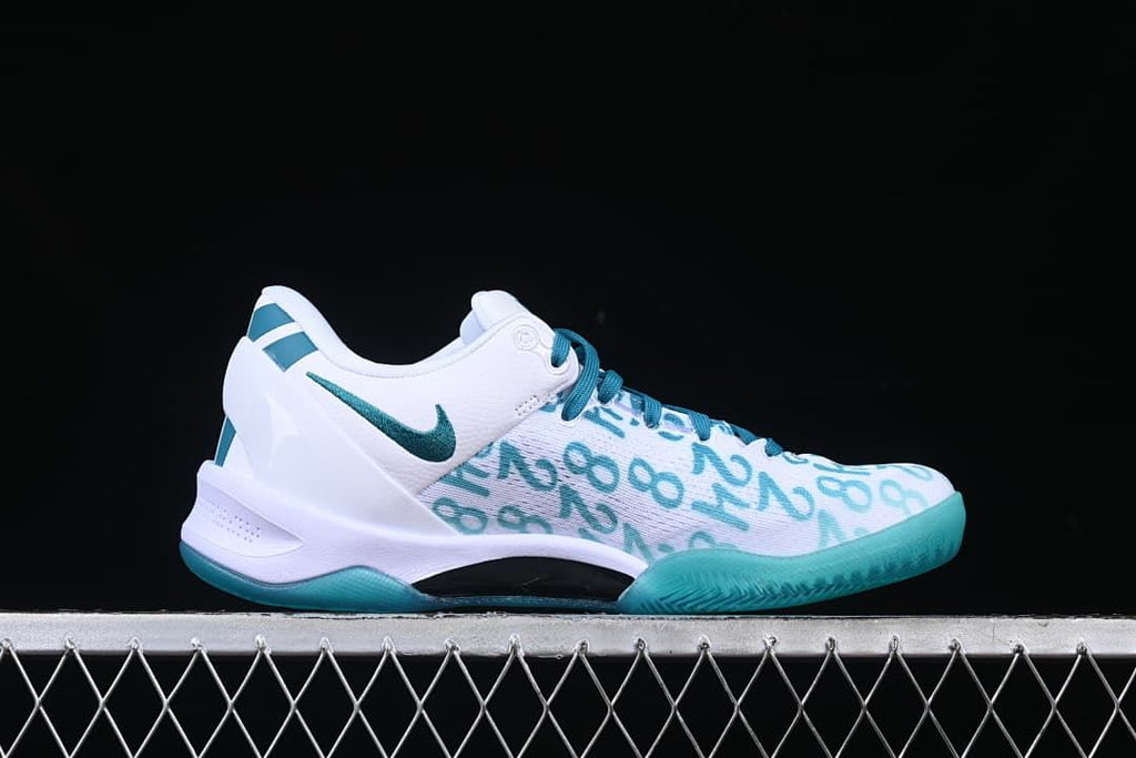 Side profile showing the white and teal upper and outsole