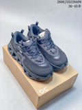Pair of charcoal On CloudSwift K-Tech 2 shoes shown from above on a shoebox.