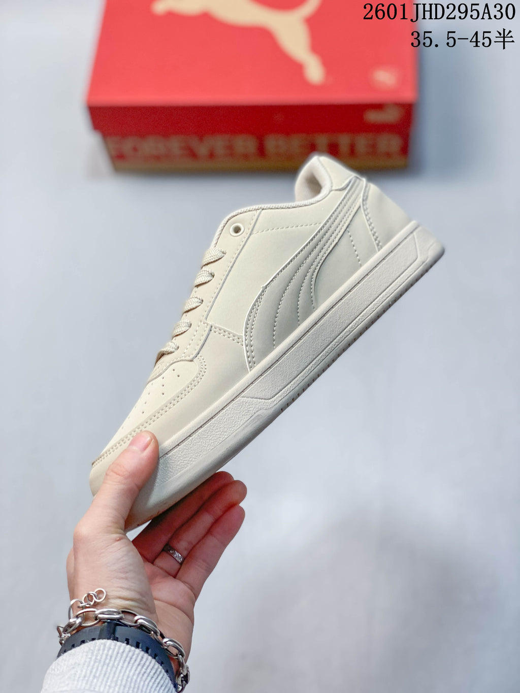 Side profile of a cream Puma Caven 2.0 low-top sneaker