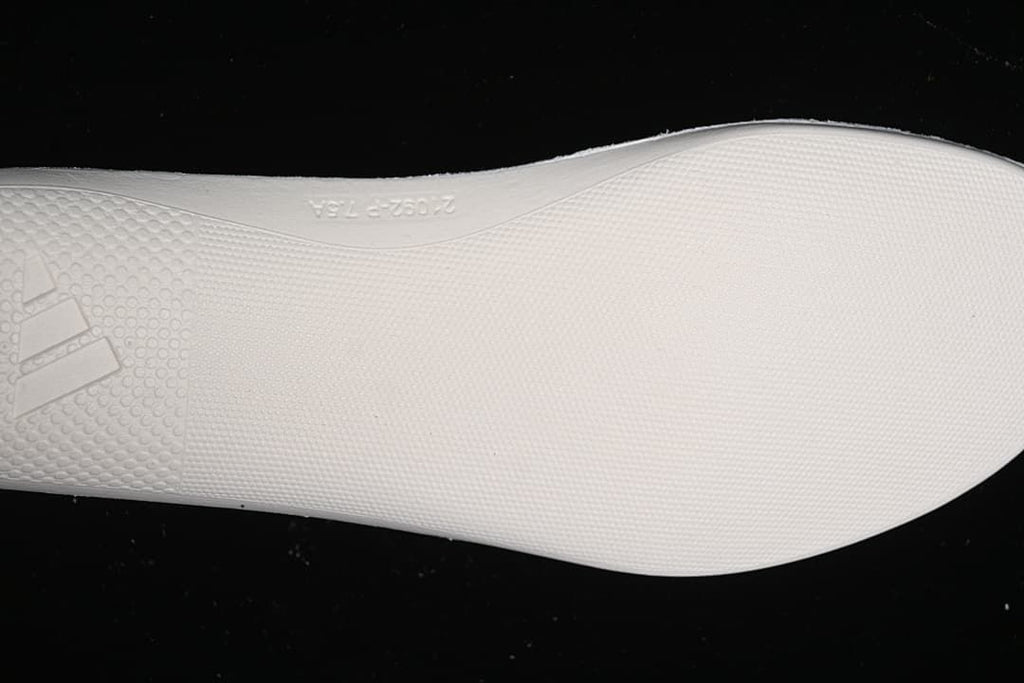 Close-up of the textured white outsole.