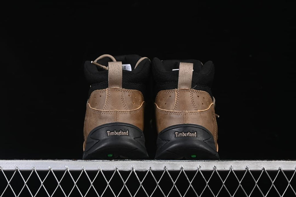 Rear view of the pair showing heel panels, pull loops, and branded heel sections.