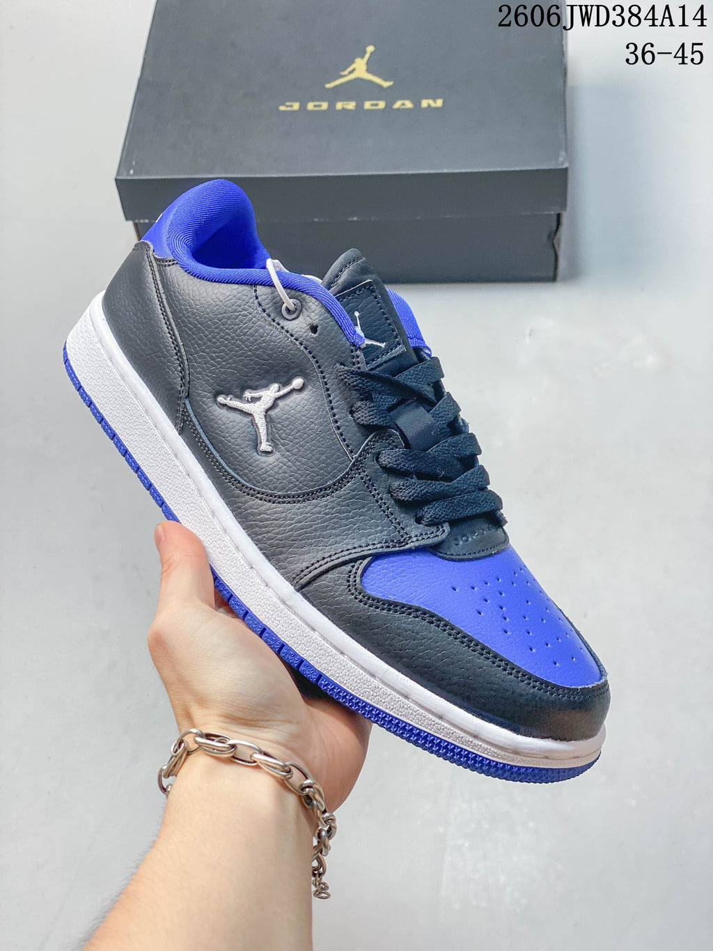 Side view of a grey Jordan Court Connect low-top with blue accents