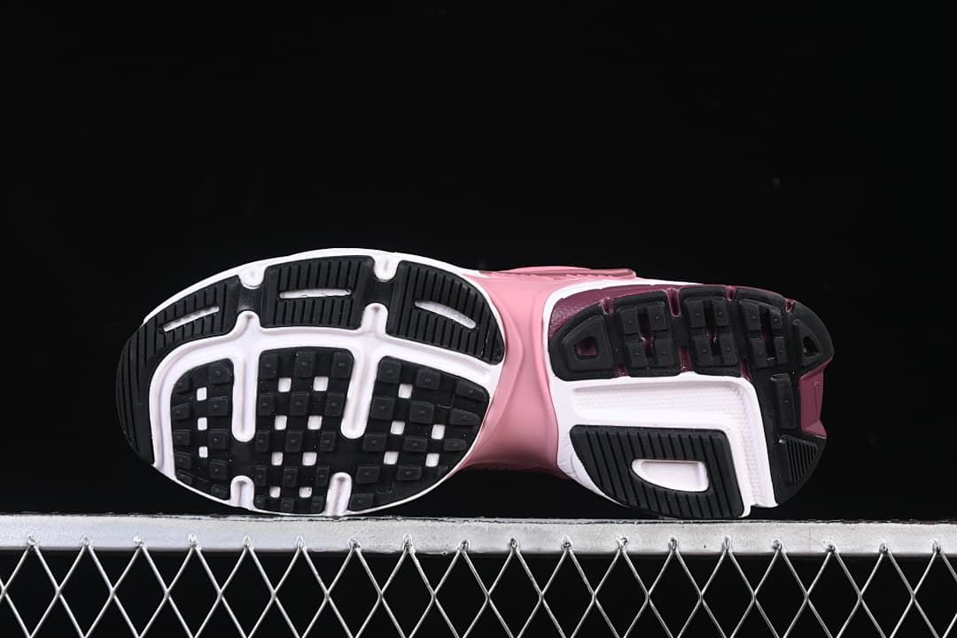 Underside view showing the patterned black, white, and burgundy outsoles