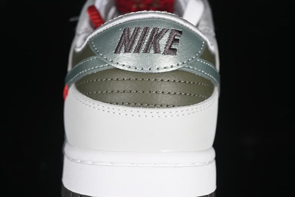 Rear view showing the silver heel panel, olive details, and Nike branding.