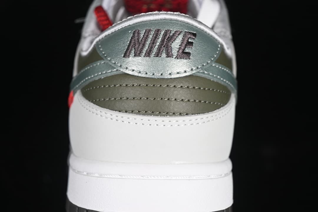 Rear view showing the silver heel panel, olive details, and Nike branding.