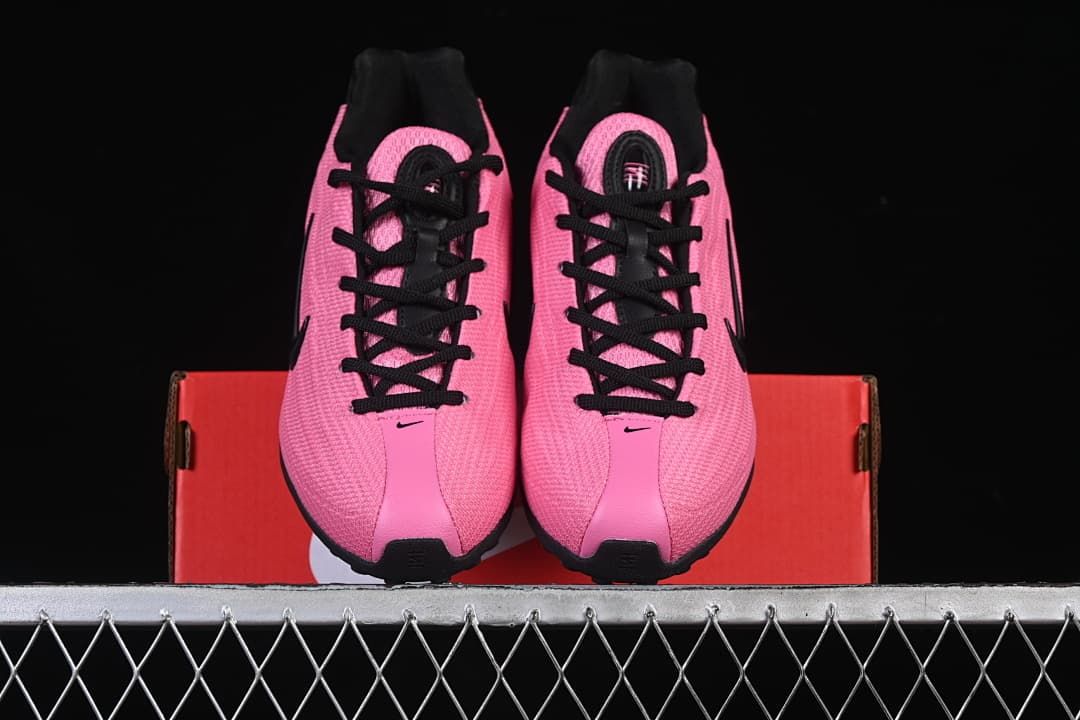 Front view of the pair showing pink uppers and black laces