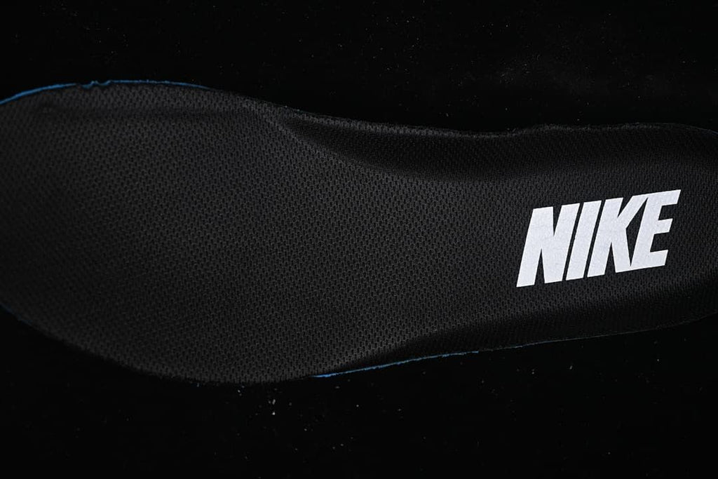 Close-up of a black fabric shoe insert with Nike branding.