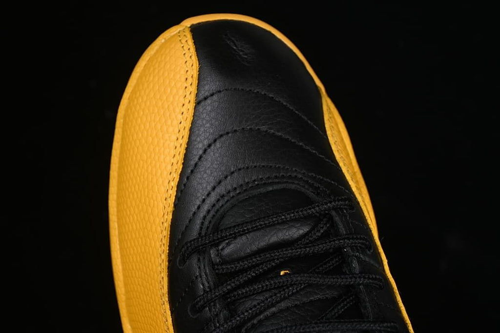Top view highlighting the black toe and gold side panels