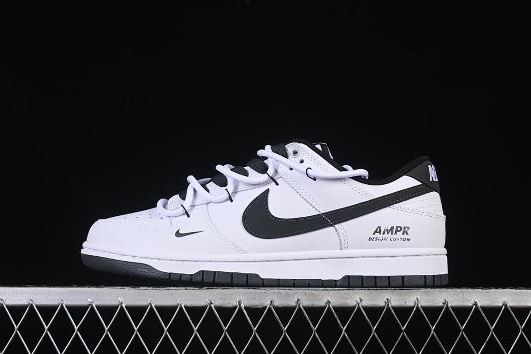 Side view of white and black Nike SB Dunk Low sneakers with layered laces