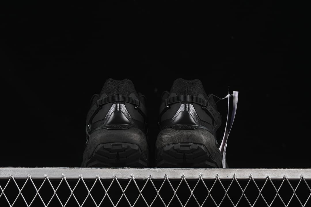Rear view of both shoes showing the heel and tread