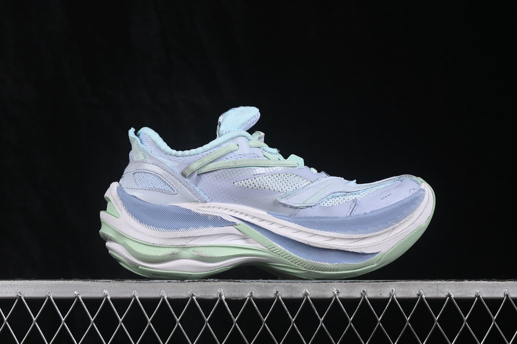 Side view of Balenciaga Jet low-top sneakers in lilac, light blue and lime with a layered platform-style sole.