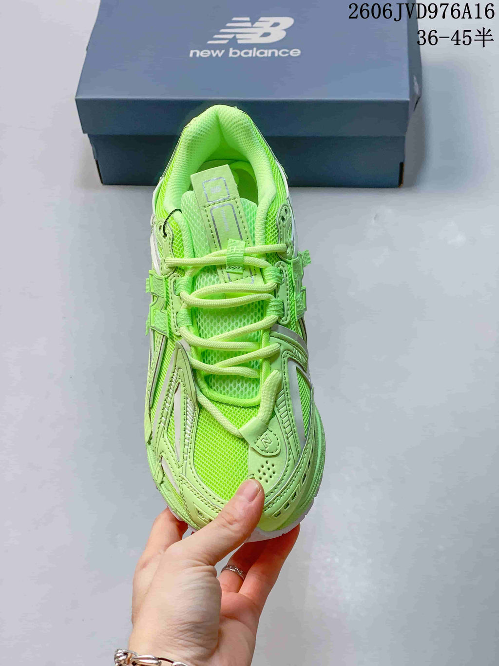 Top view of the lime-green New Balance sneaker showing its laces and upper