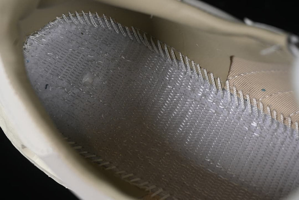 Close-up view inside the sneaker near the sole and lining