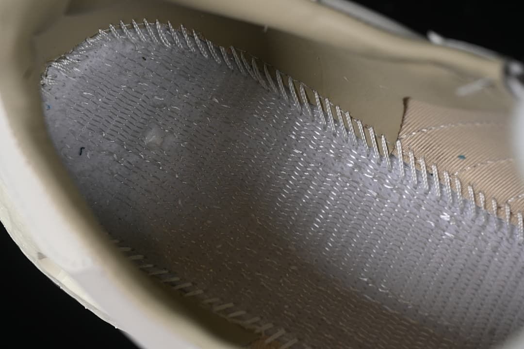 Close-up view inside the sneaker near the sole and lining