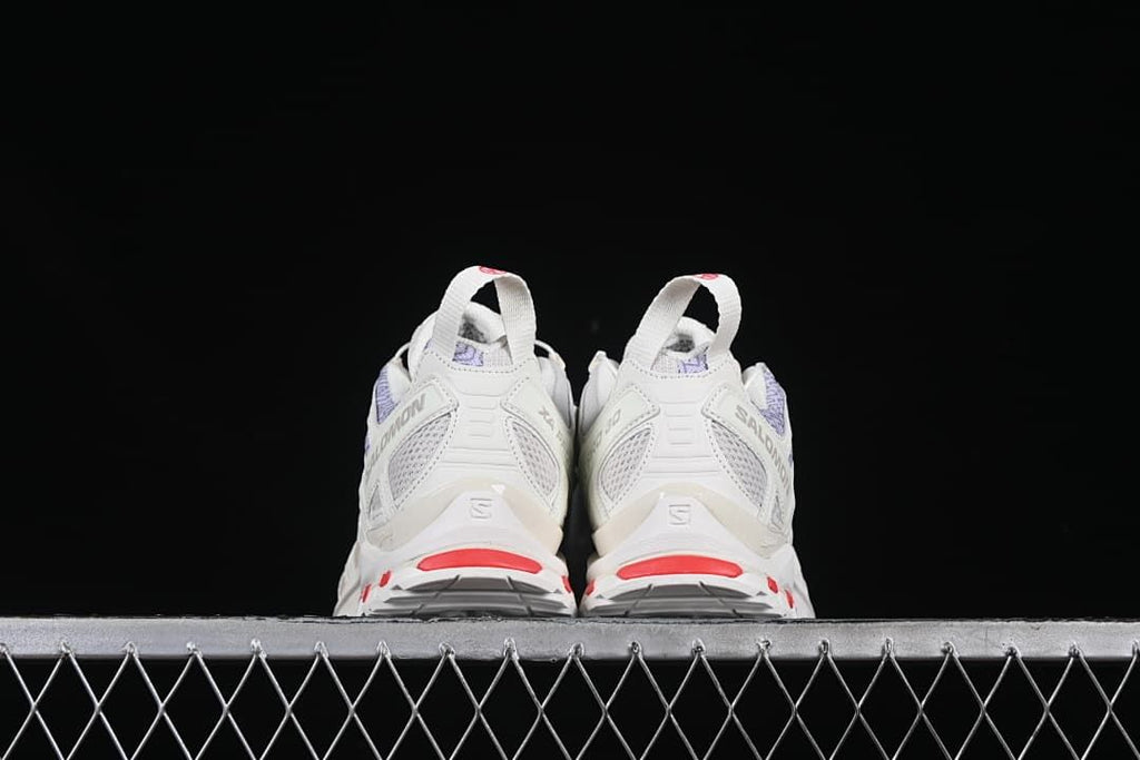 Rear view of the pair showing heel details and red accents.