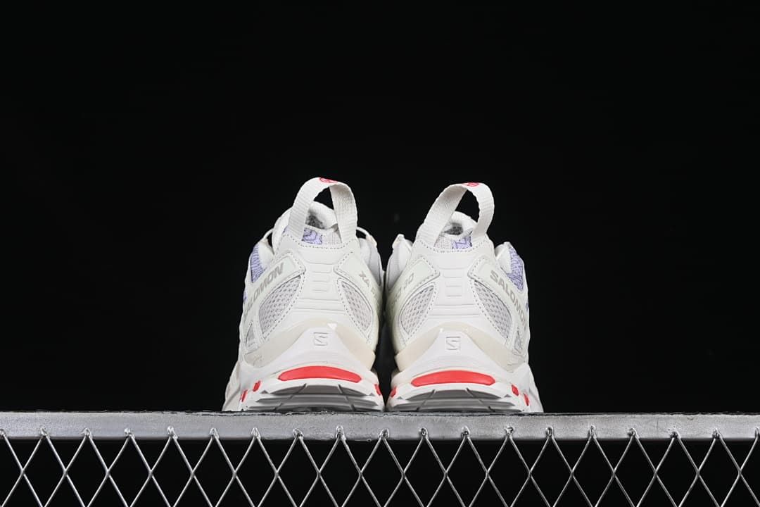 Rear view of the pair showing heel details and red accents.