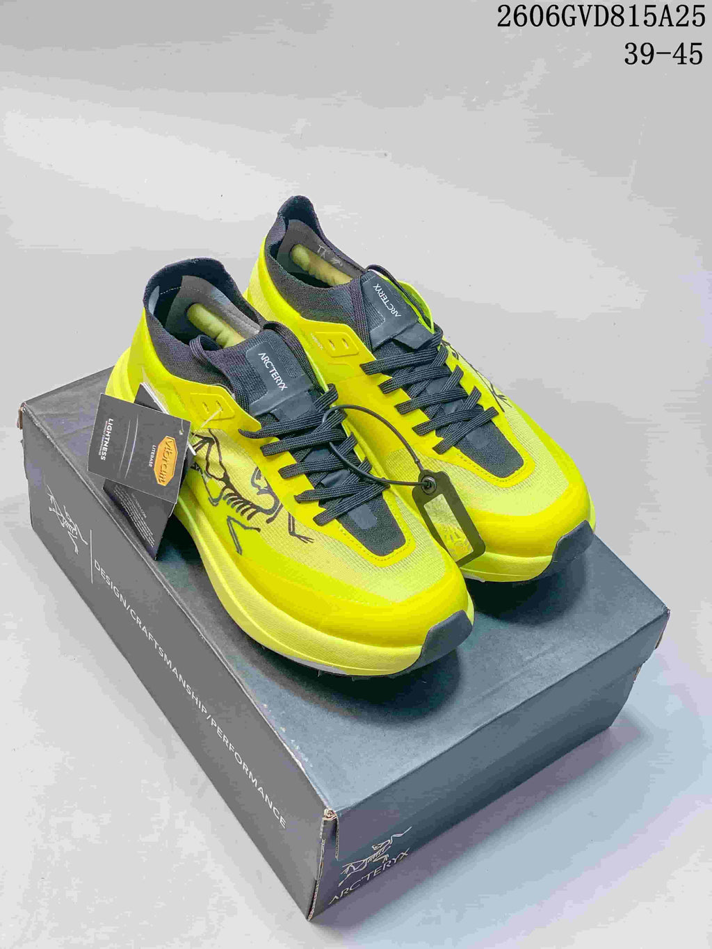 Yellow and pink Arc'teryx KNORVAN SY low-top shoes shown together.
