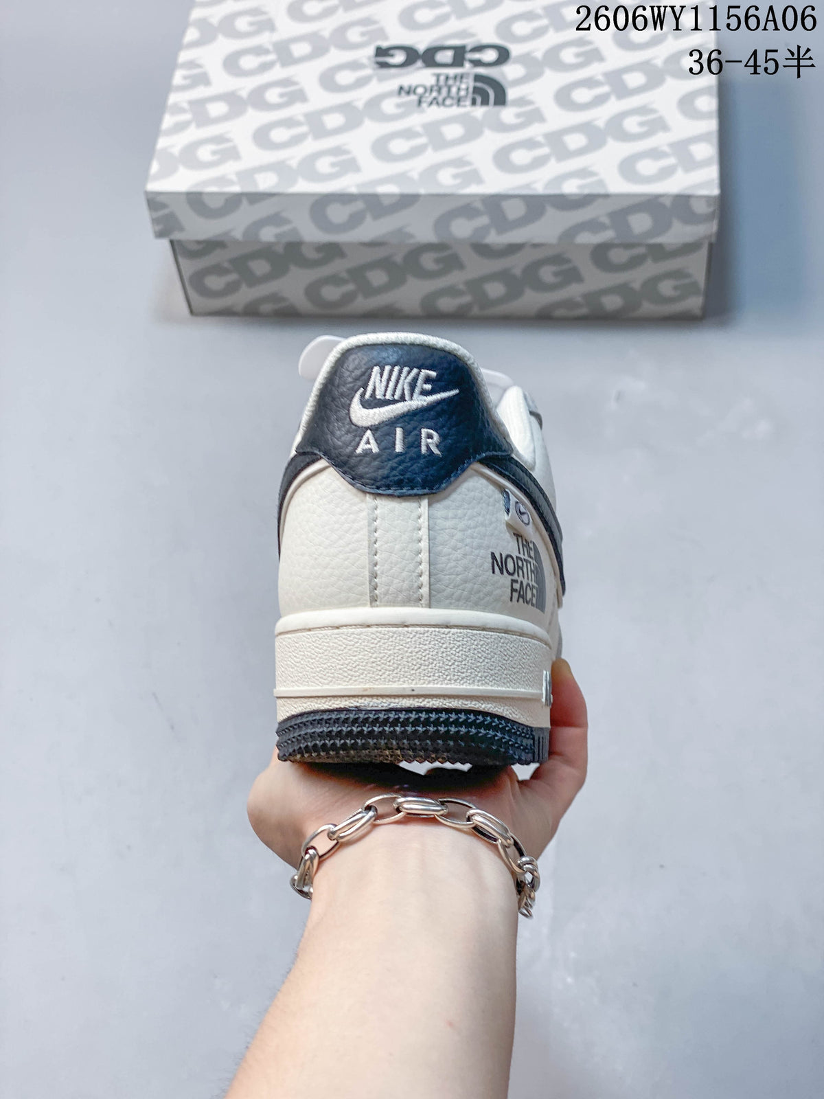 Heel view of an off-white Nike Air Force 1 '07 Low sneaker with navy detailing.