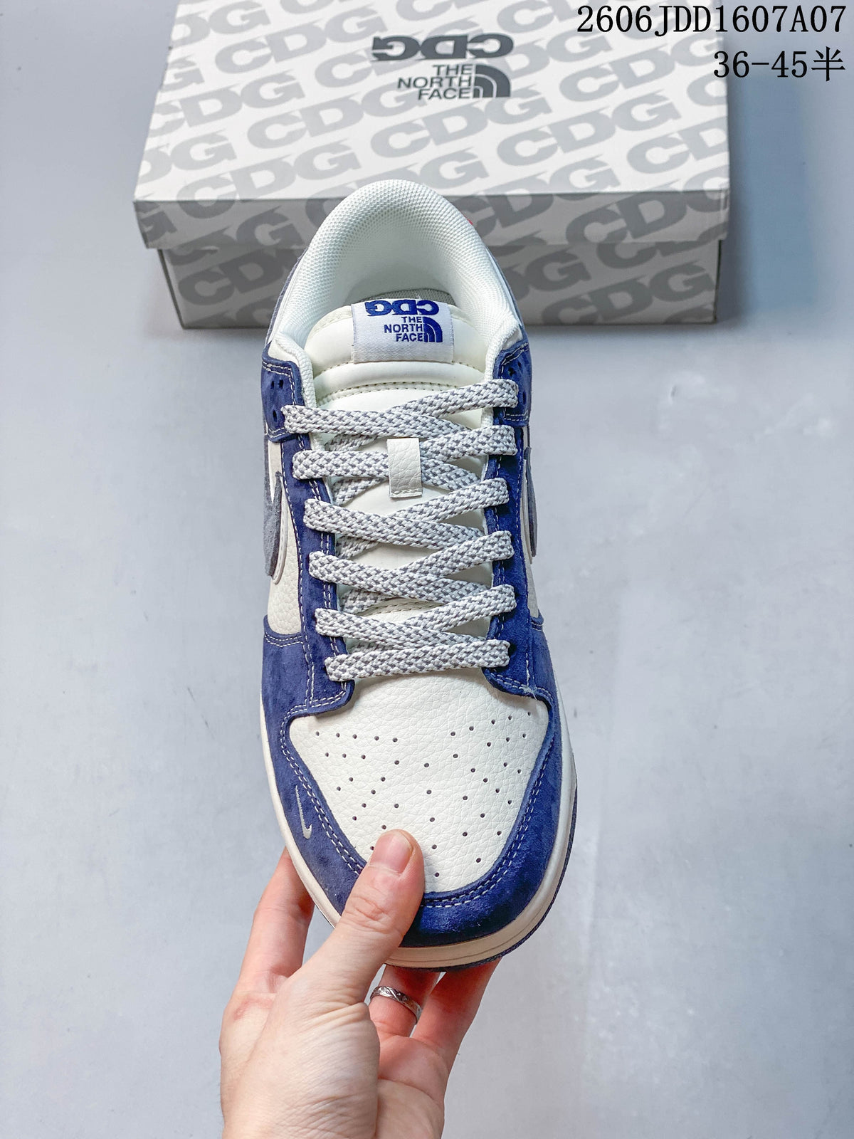 Top view showing perforated toe, blue overlays, and gray laces