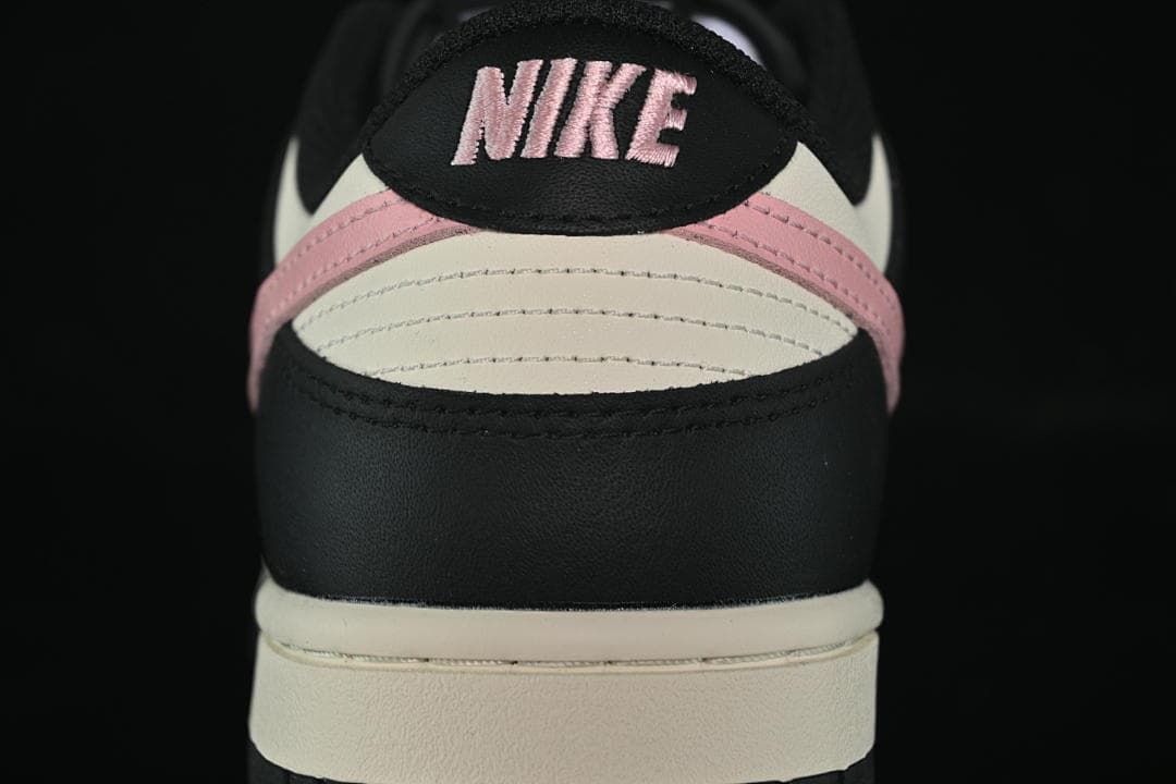 Rear view showing black heel panels and pink and off-white accents