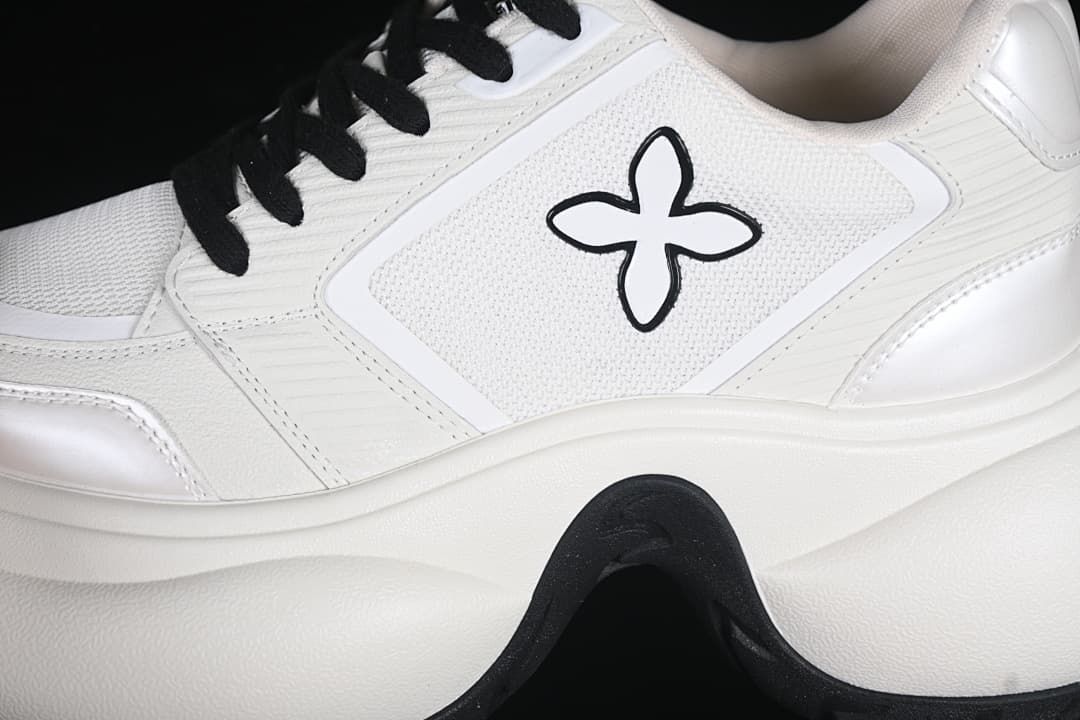 Close-up of the side emblem, panels, and chunky sole