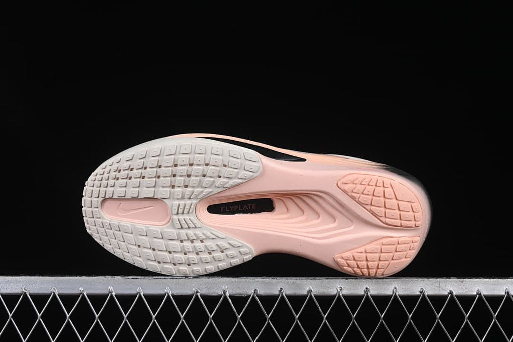 Outsole view showing patterned tread and a Flyplate marking
