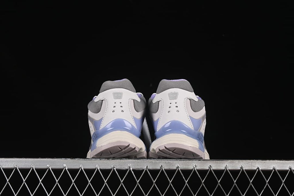 Rear view of both shoes showing the heel and outsole edges.
