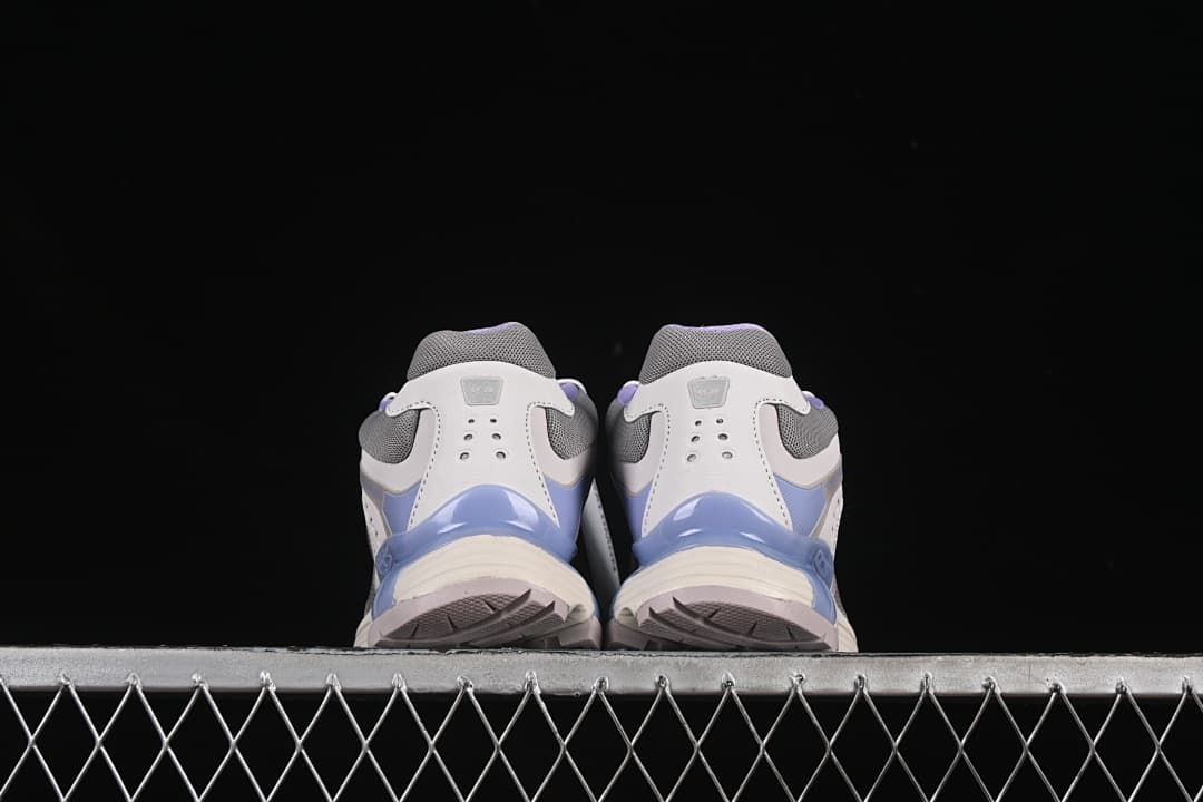 Rear view of both shoes showing the heel and outsole edges.
