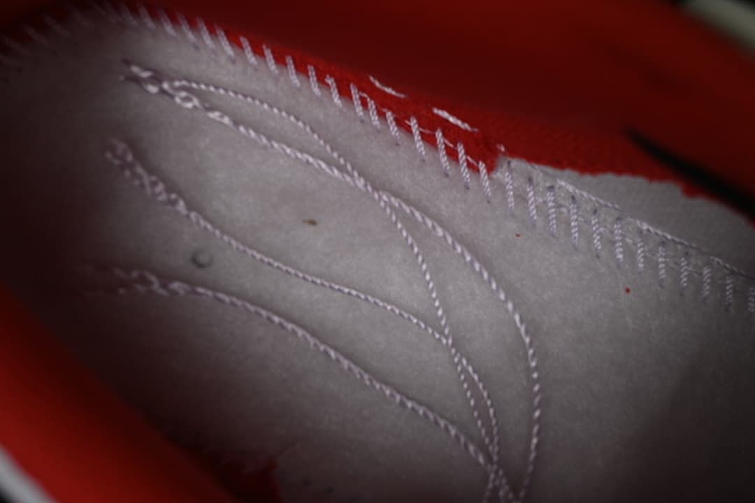 Close-up of stitching and panel details inside the sneaker