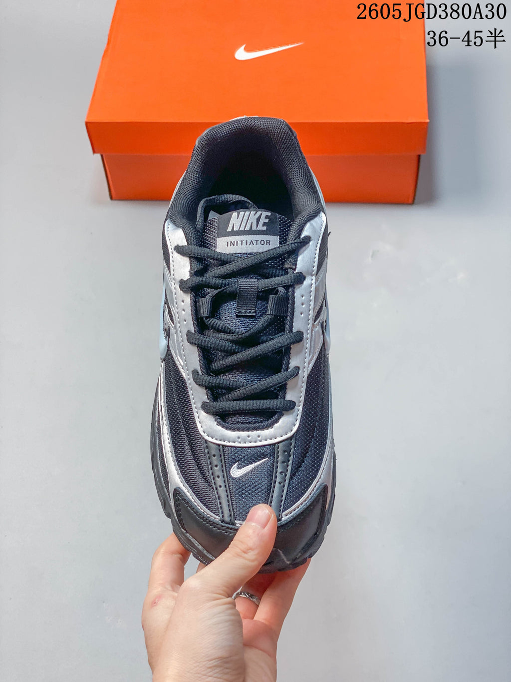 Top view of a Nike Initiator sneaker showing its laces and tongue label