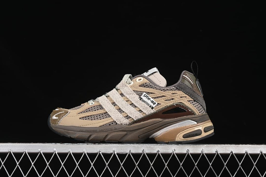 Side view of the tan, grey and brown adidas Adistar Cushion sneaker
