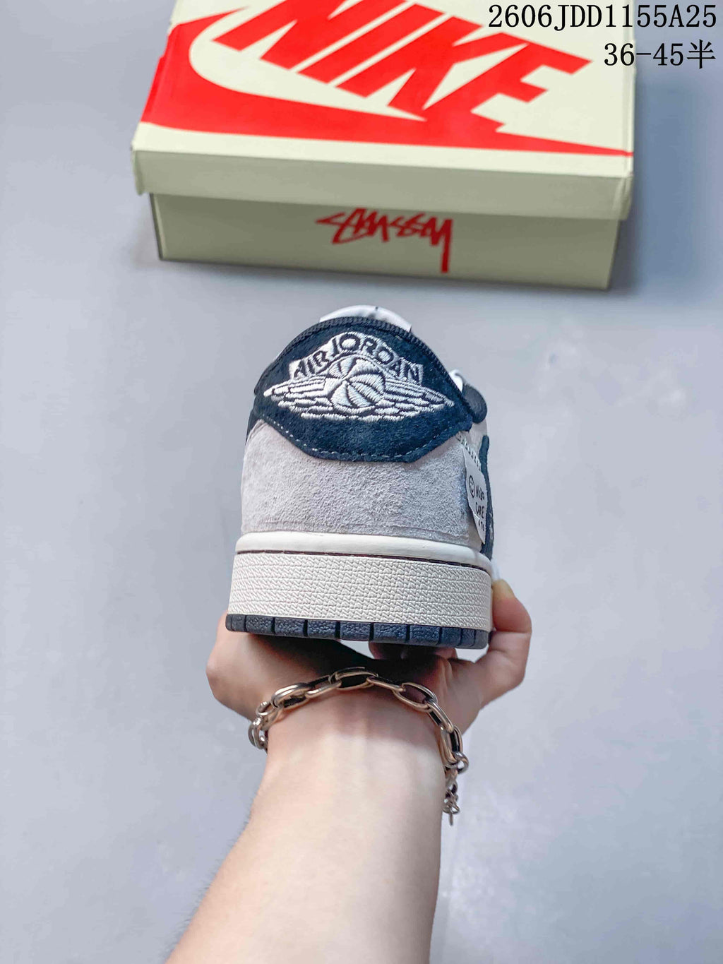 Rear view showing the embroidered heel detail and contrasting panels