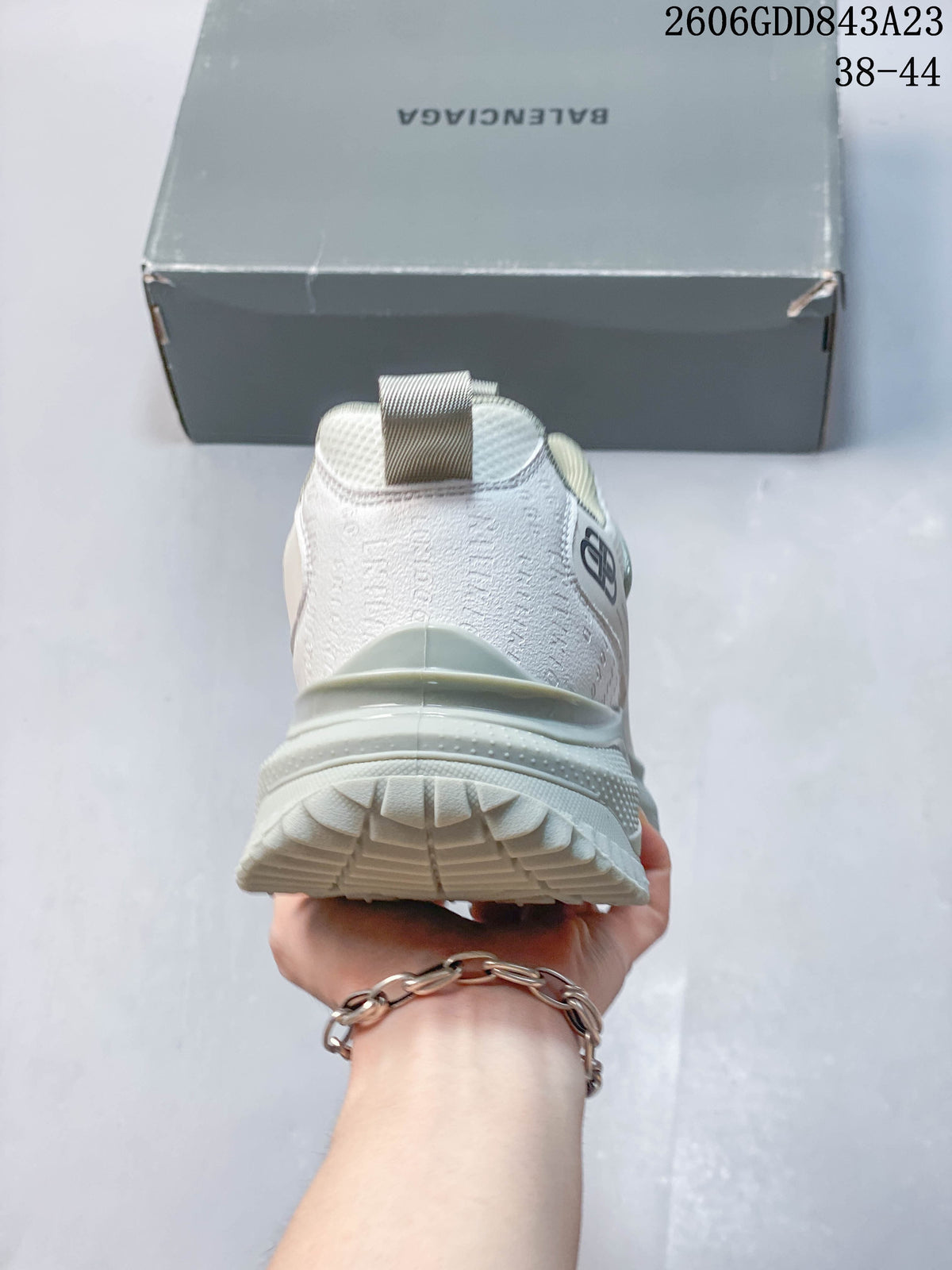 Rear view showing the sneaker heel, pull tab, and layered sole