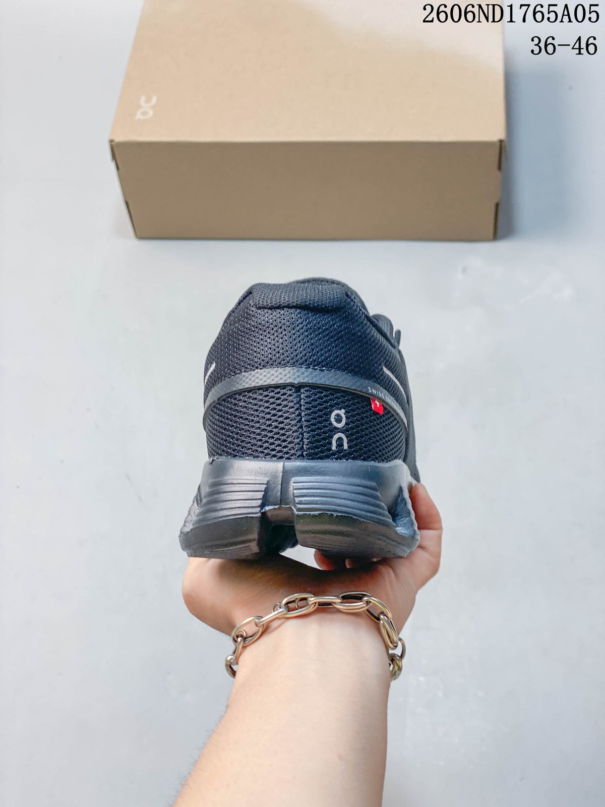 Rear view of a dark gray sneaker showing the heel and sole.