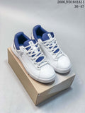 Pair of white and blue On low-top sneakers with white laces, shown on a shoebox.
