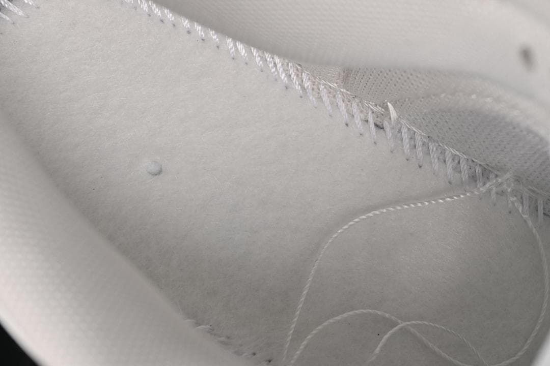 Close-up of stitching and lining inside the shoe
