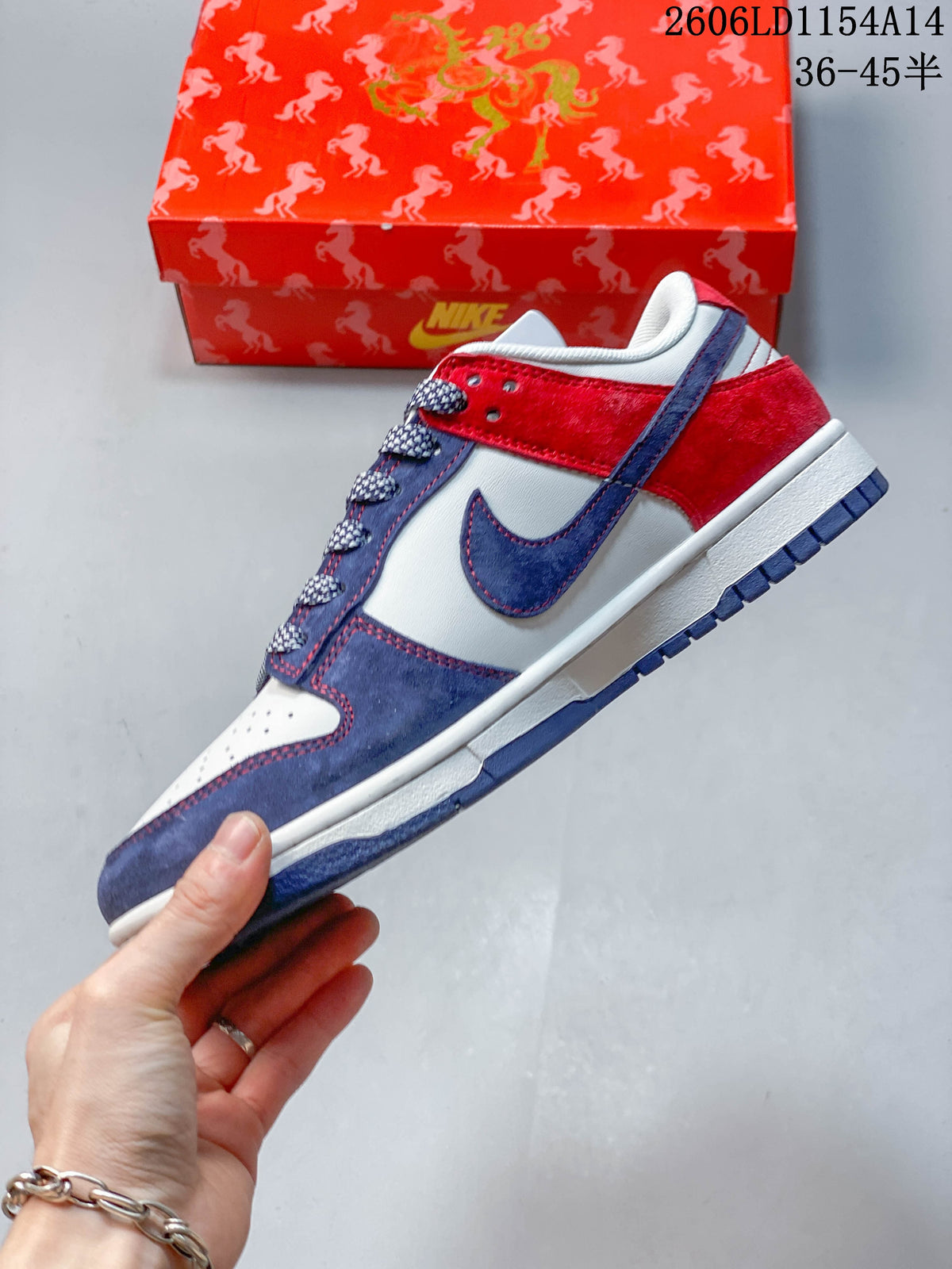Side profile showing the contrasting overlays and swoosh on the Nike SB Dunk Low