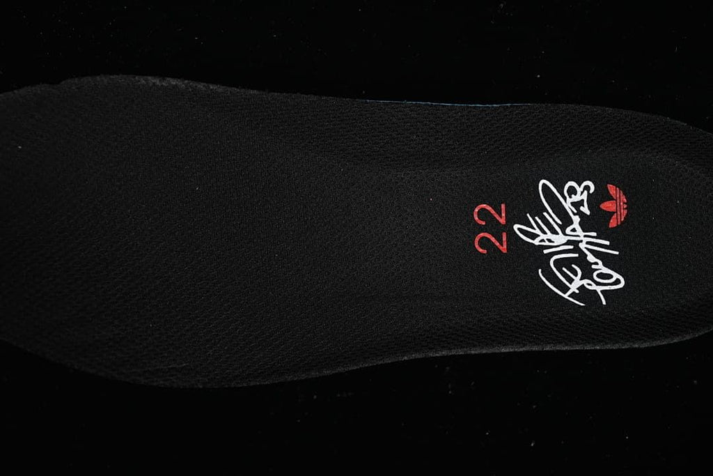 Black insole with a printed graphic and red number