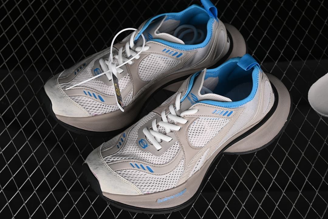 Pair of beige and blue Circuit sneakers shown from above