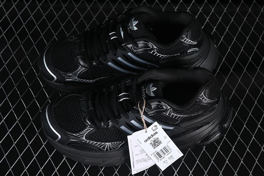 Pair of black Adistar XLG sneakers displayed with tags