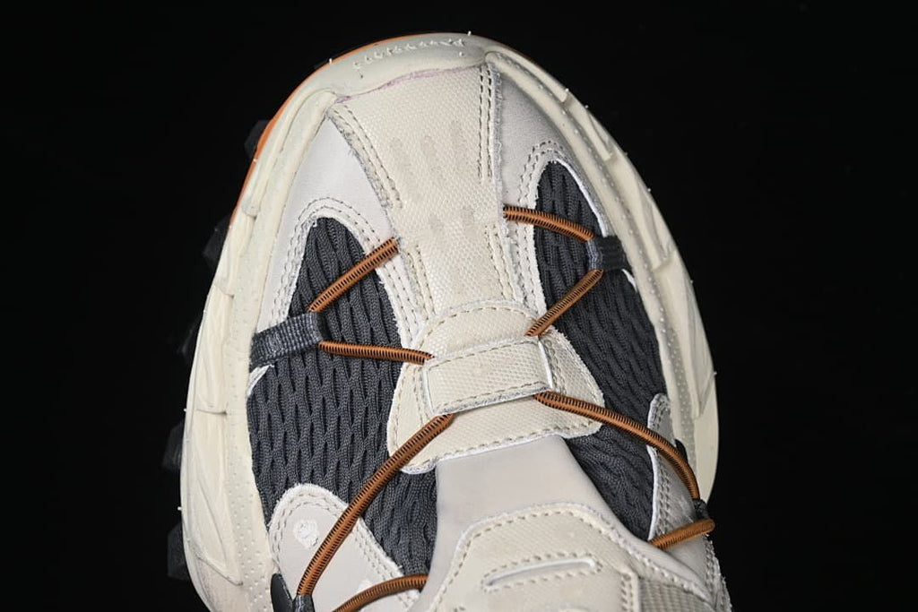 Top view of the sneaker showing the charcoal panels and cord lacing