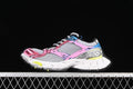 Side view of multicolor Balenciaga Stapler sneakers against a dark background