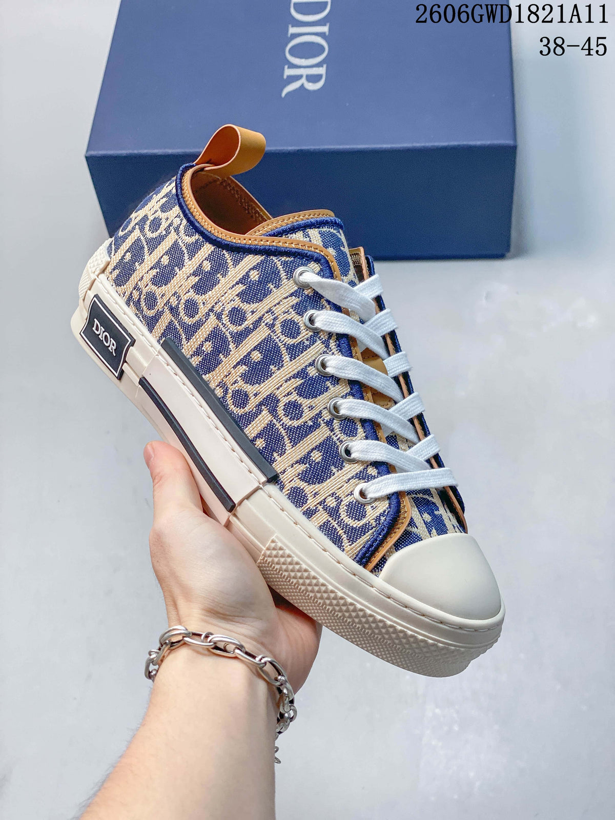 Angled side view of a patterned sneaker with a heel label, white laces, and cream-colored sole